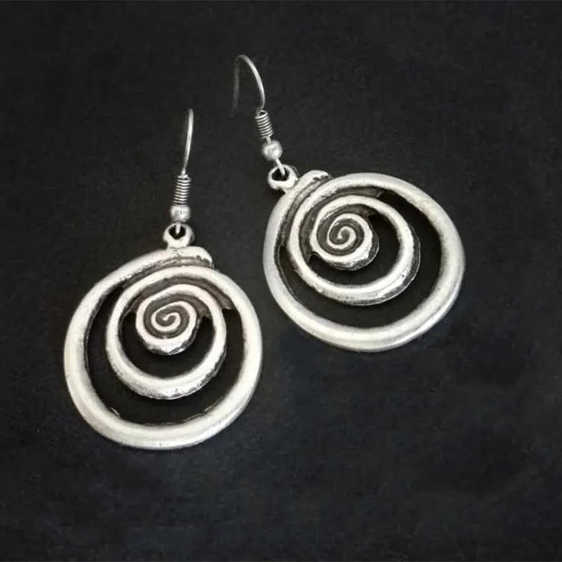 Silver geometric spiral distressed earrings measuring 2.6cm by 5cm with alloy construction