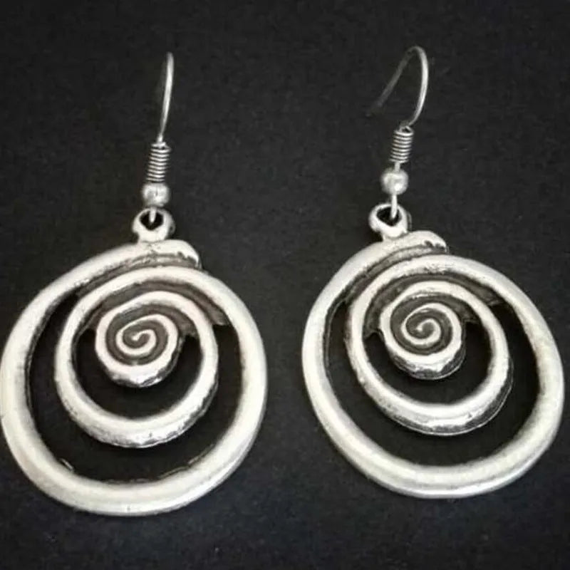 Silver geometric spiral distressed earrings measuring 2.6cm by 5cm with alloy construction