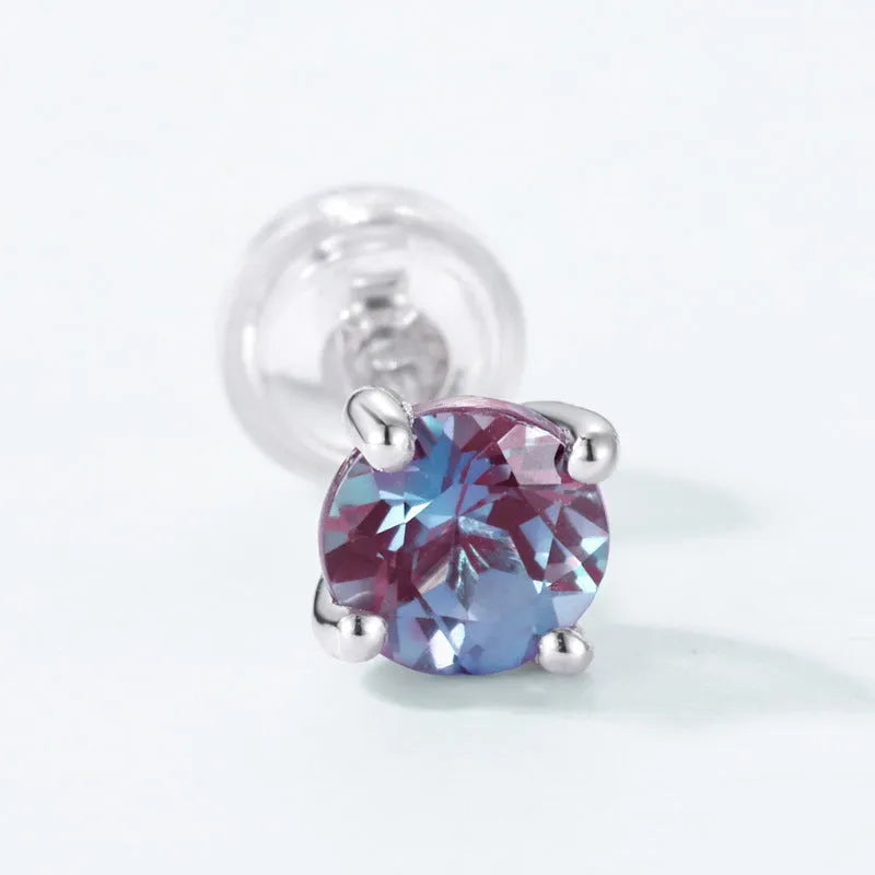 A pair of simple geometric ear studs for women in cultivated Alexandrite colour, made from 925 silver.