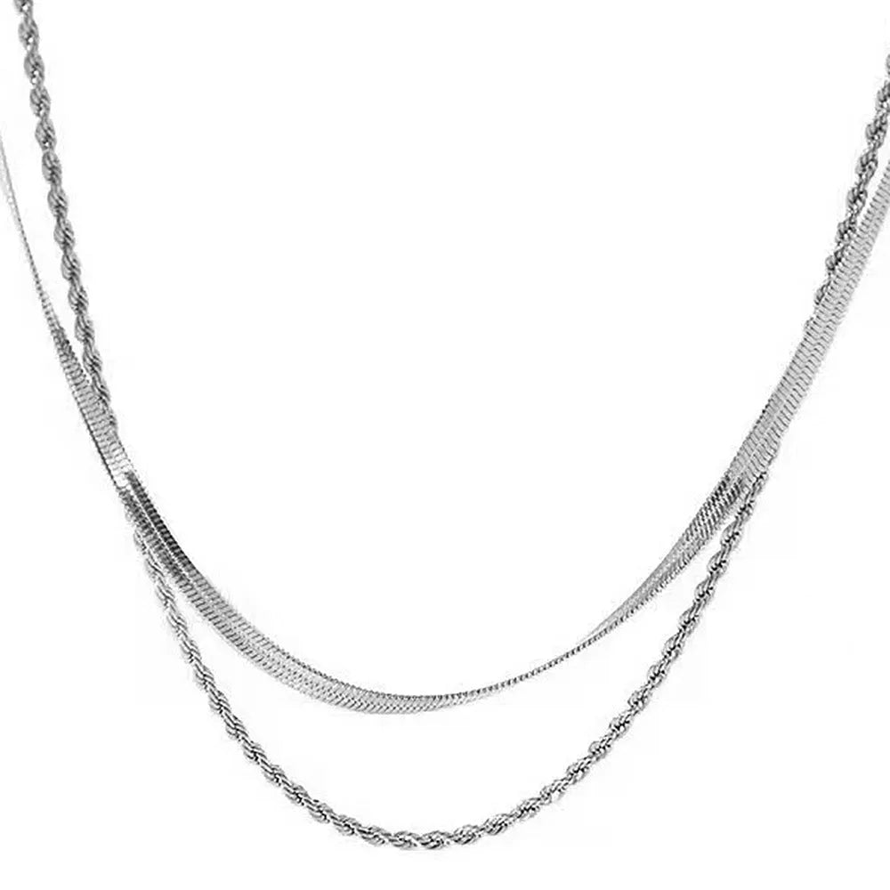 Women's adjustable double-layer twist necklace in stainless steel with geometric titanium steel pendant.