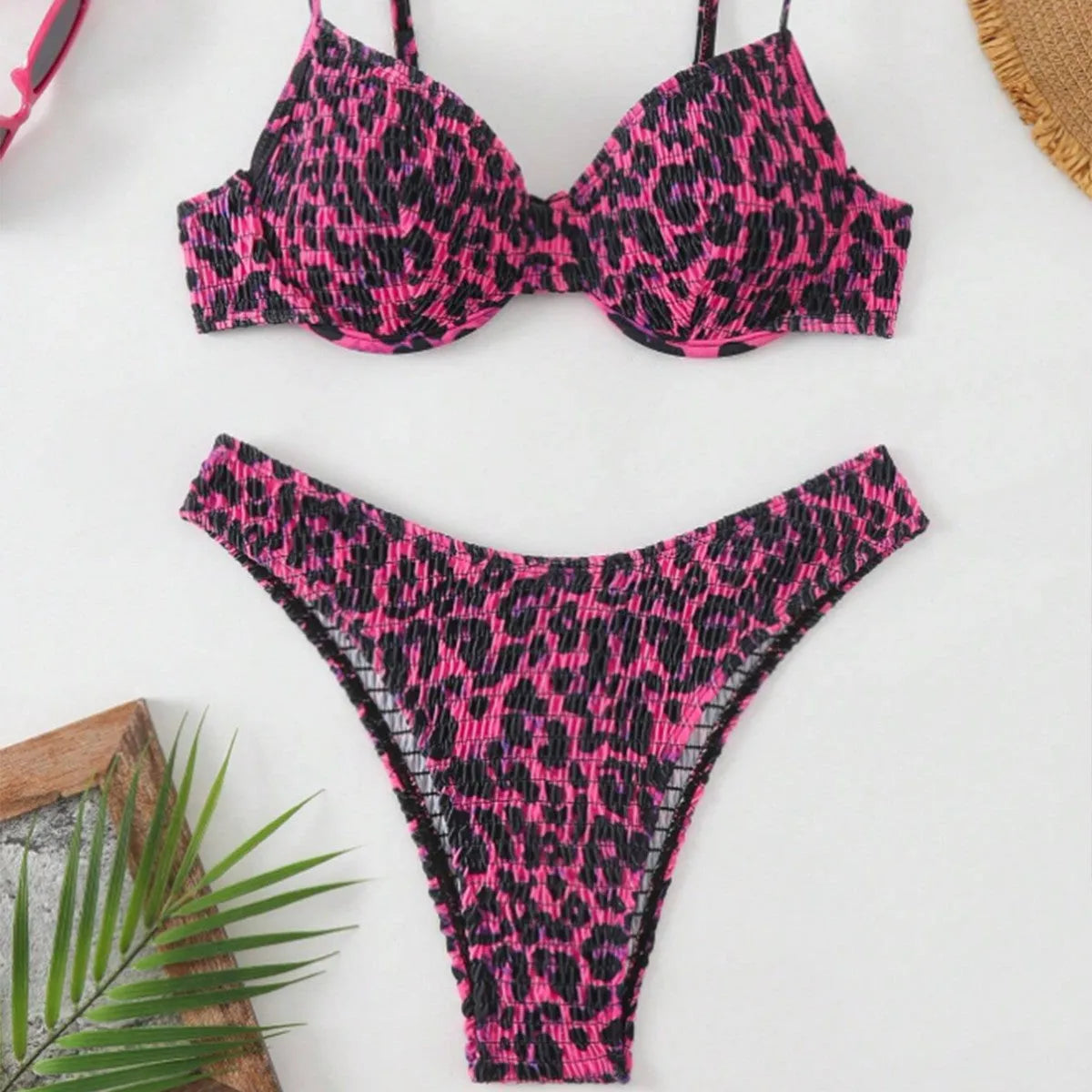 Women's leopard print backless bikini in brown mixed colour on a mannequin.