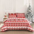 Red Christmas Love Song pattern bed cover-style quilt and pillowcases on a bed.