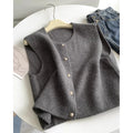 Women's casual polyester pullover in Angora red with half-length sleeves on a hanger.