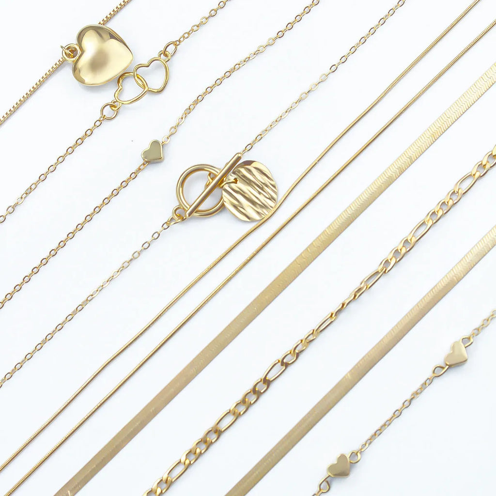Gold women's necklace set of 10 pieces with snake bone chains and adjustable length