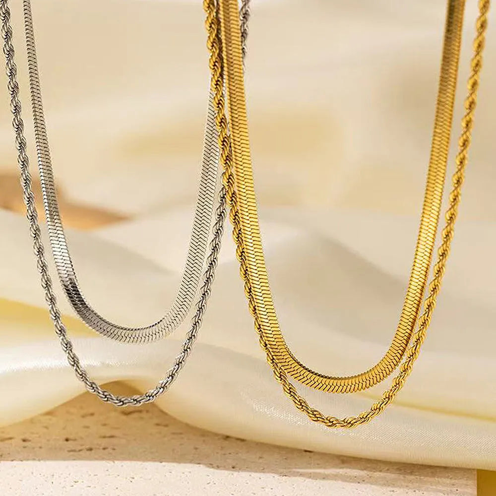 Women's adjustable double-layer twist necklace in stainless steel with geometric titanium steel pendant.