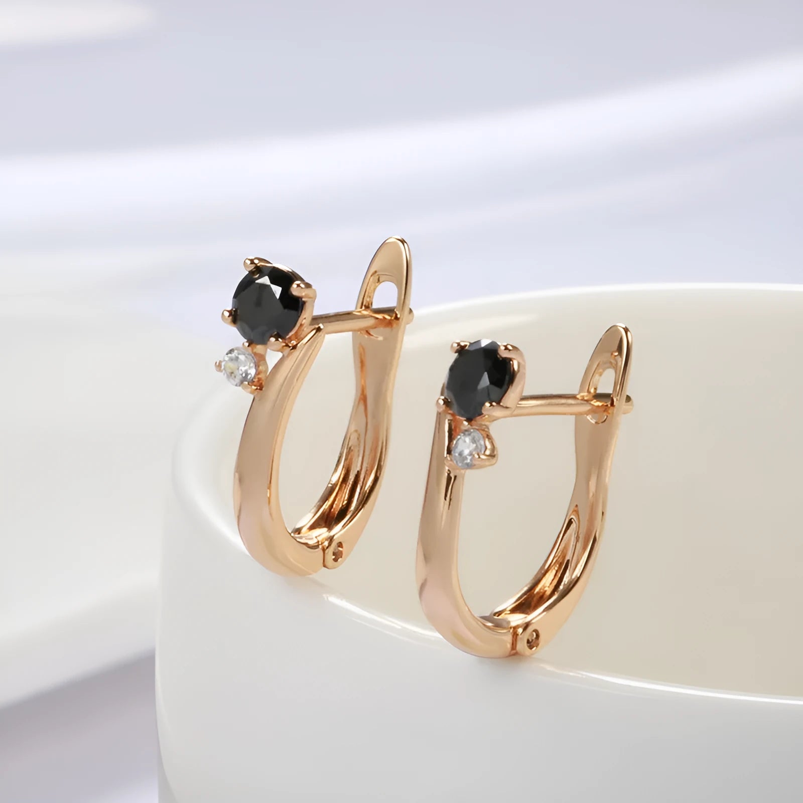 Women's black agate drop earrings with gold-plated copper geometric settings