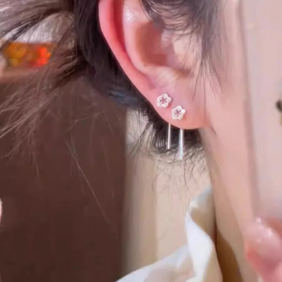 Silver colour hollow flower hanging earrings with petal design on alloy posts