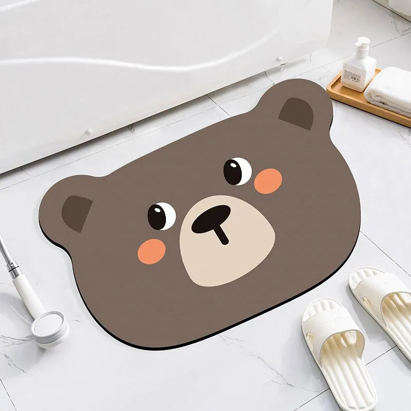 Colourful cartoon animal diatomaceous earth bathroom mat on tiles, showing non-slip base and absorbent texture.