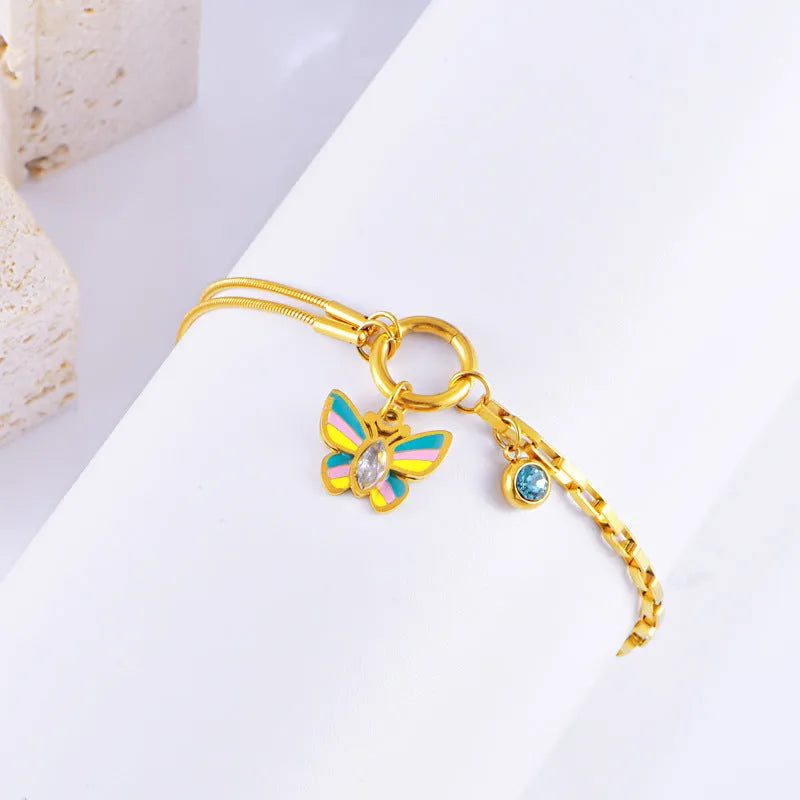 Gold tone titanium steel necklace and bracelet set with butterfly pendant for women
