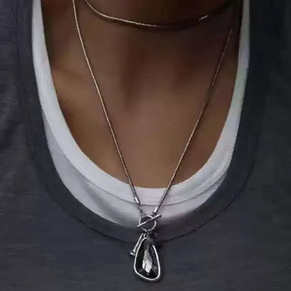 Long geometric pendant sweater chain necklace with snake bones chain in blue, champagne, or grey.