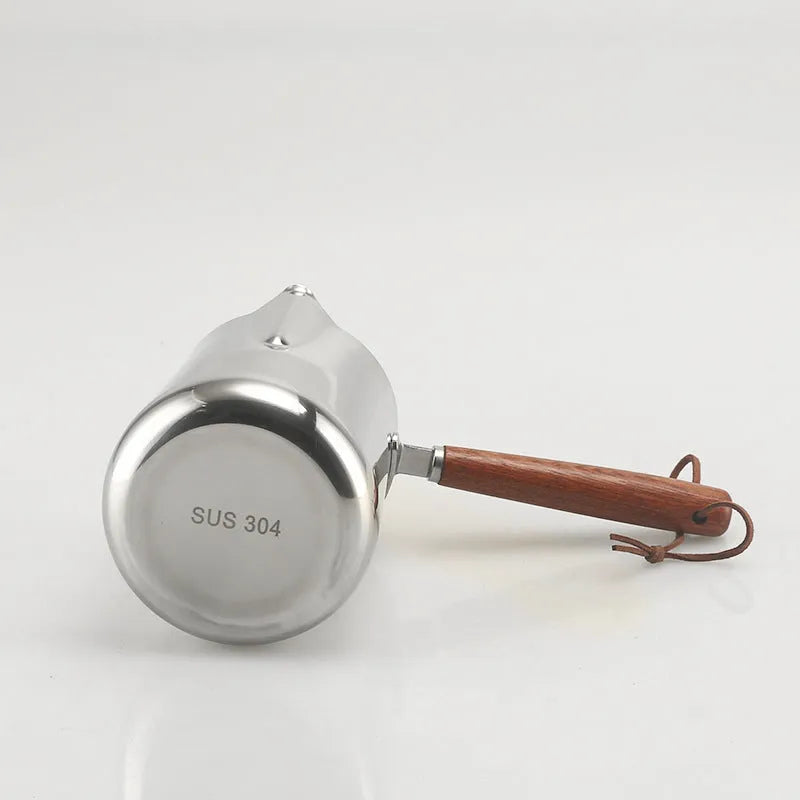 Stainless steel milk jug with wooden handle for latte art, shown in 350ml, 600ml and 1000ml sizes.