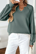 Women's long sleeve sweater with a half-open lace-stitch collar in a solid colour.