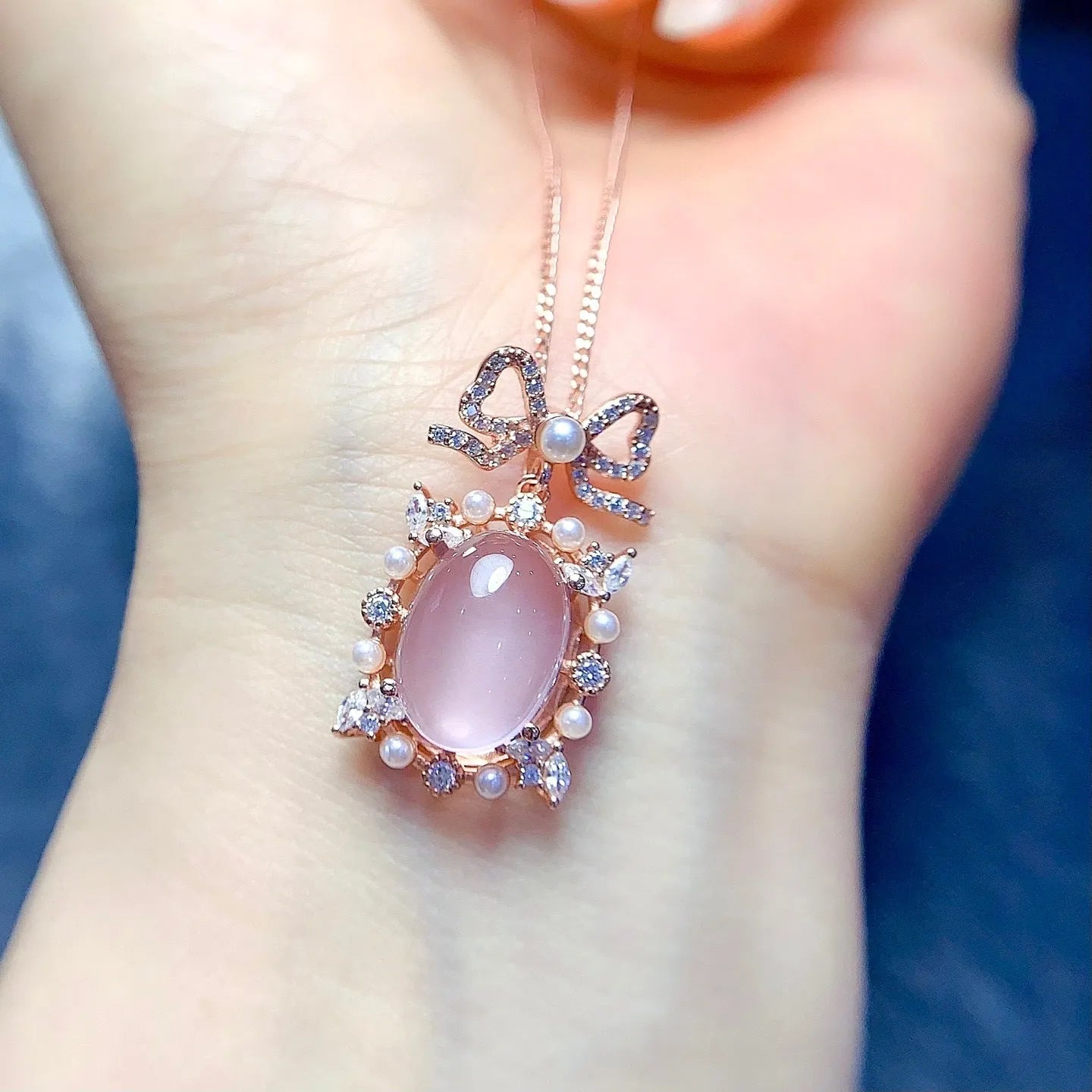 Pink crystal rose quartz pendant with rose gold plated geometric setting on alloy necklace