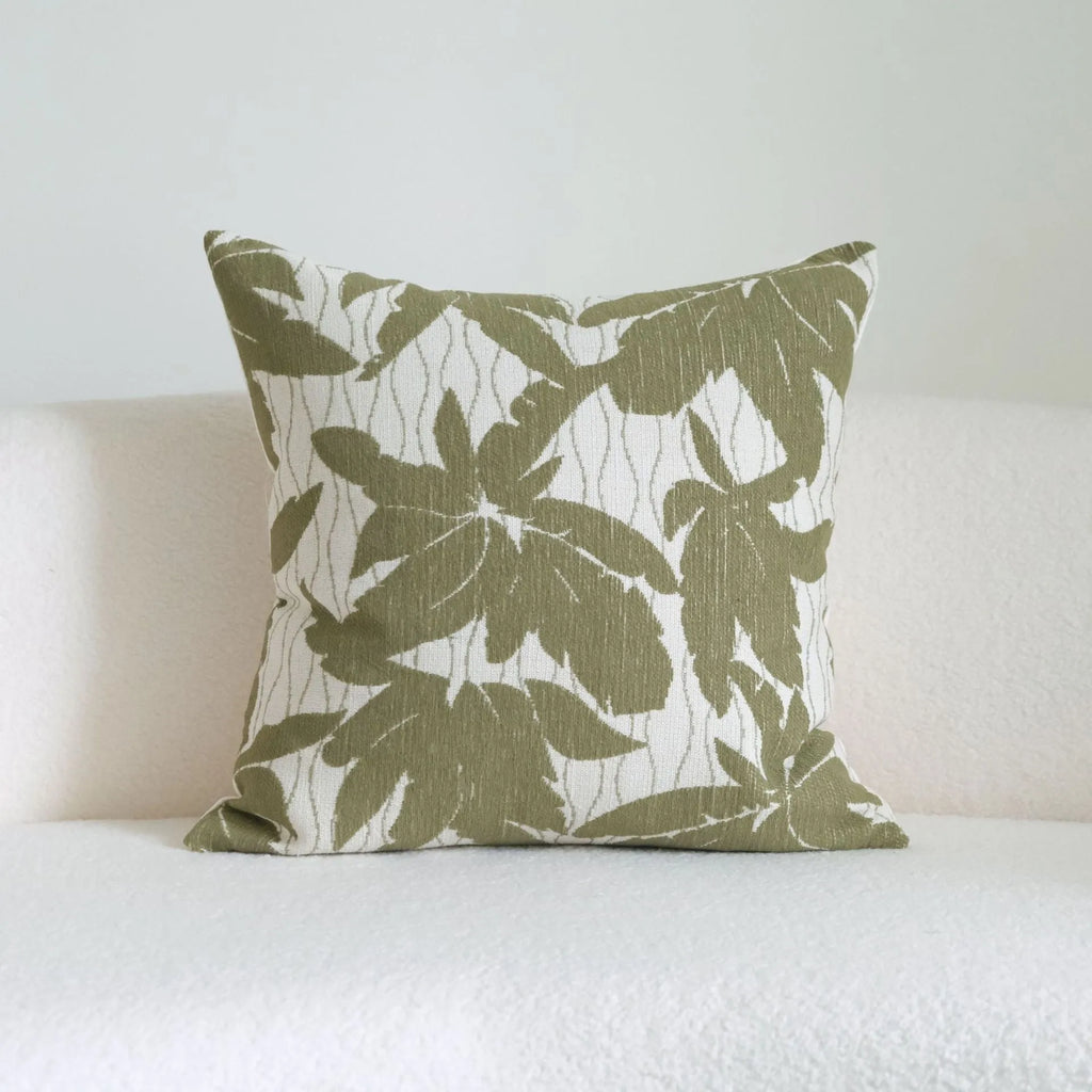 Green striped and botanical patterned cotton linen decorative pillow with tassel detail.