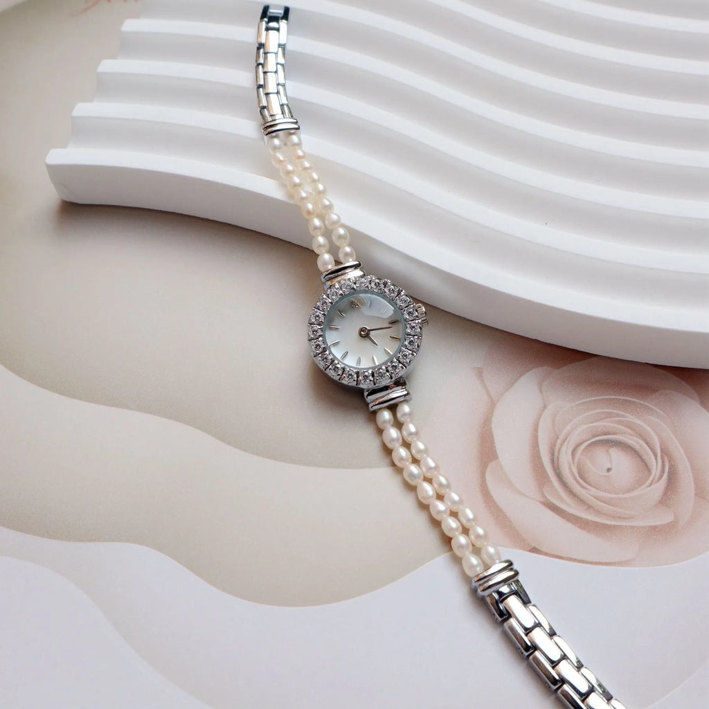 Women's light gold bracelet watch with natural freshwater pearls and 18mm round dial