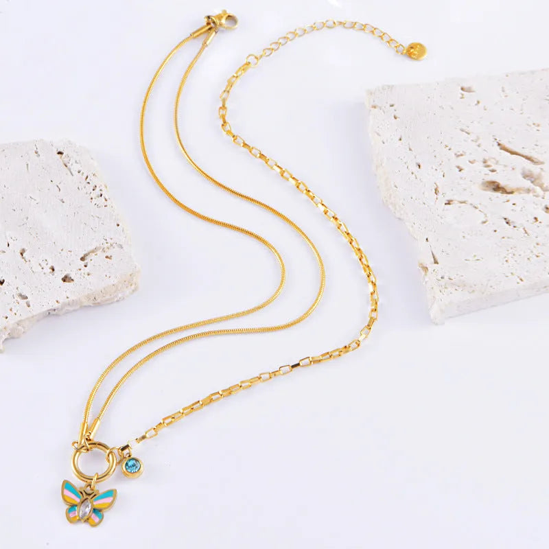 Gold tone titanium steel necklace and bracelet set with butterfly pendant for women