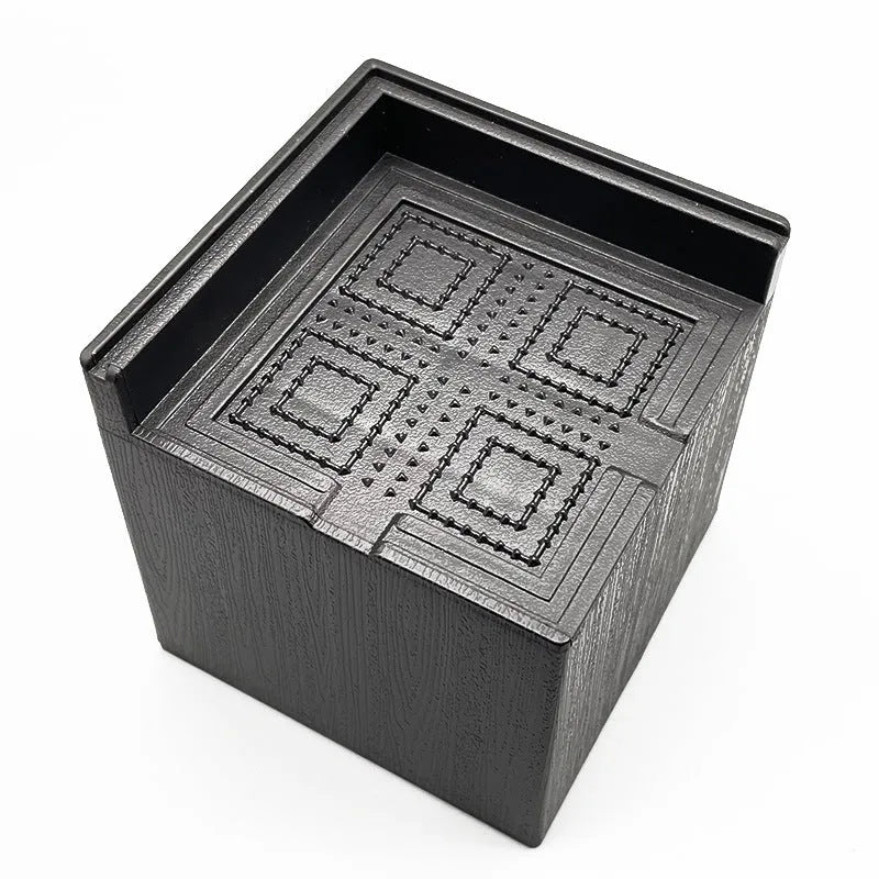 Four black plastic bed risers for raising furniture height with thickened support mats