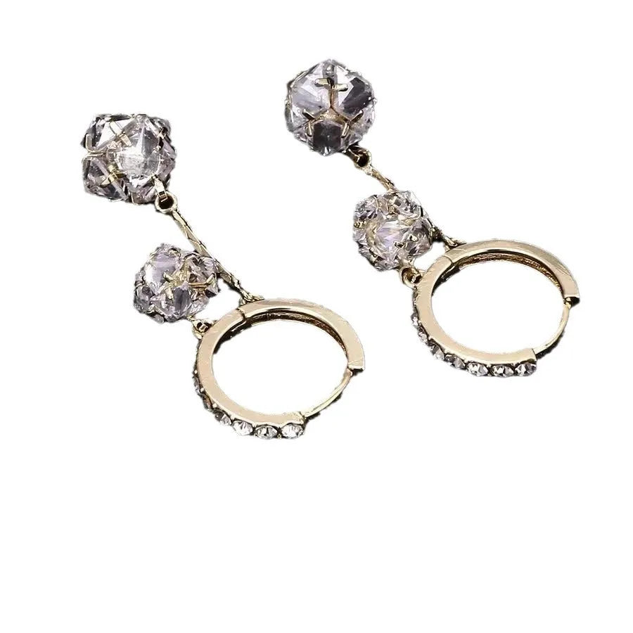 Silver-colour women's clip-on earrings with a confession balloon design, rhinestone ball, and double tassel pendant.