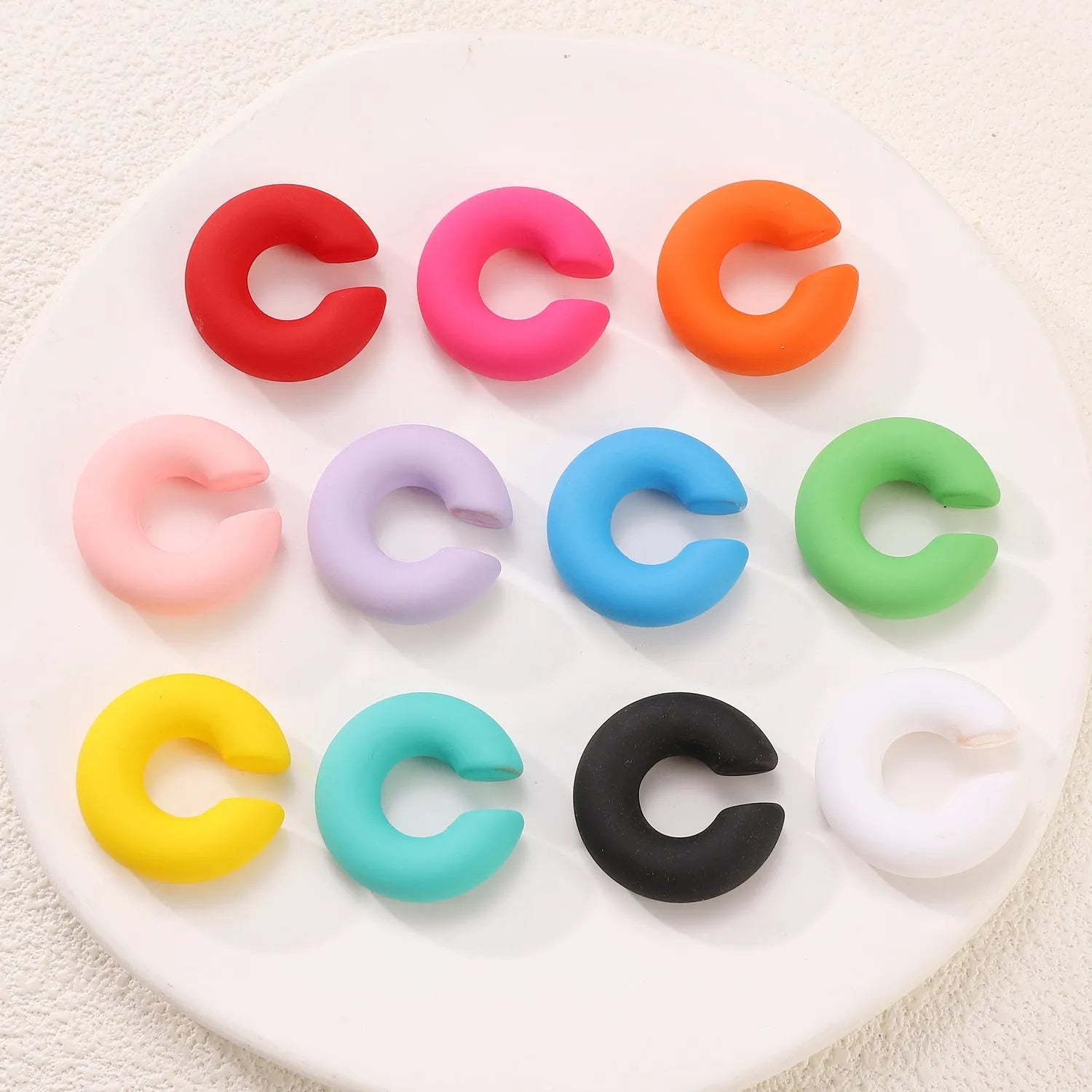 CCB material non-piercing ear clips in geometric C-shape with matte candy colours