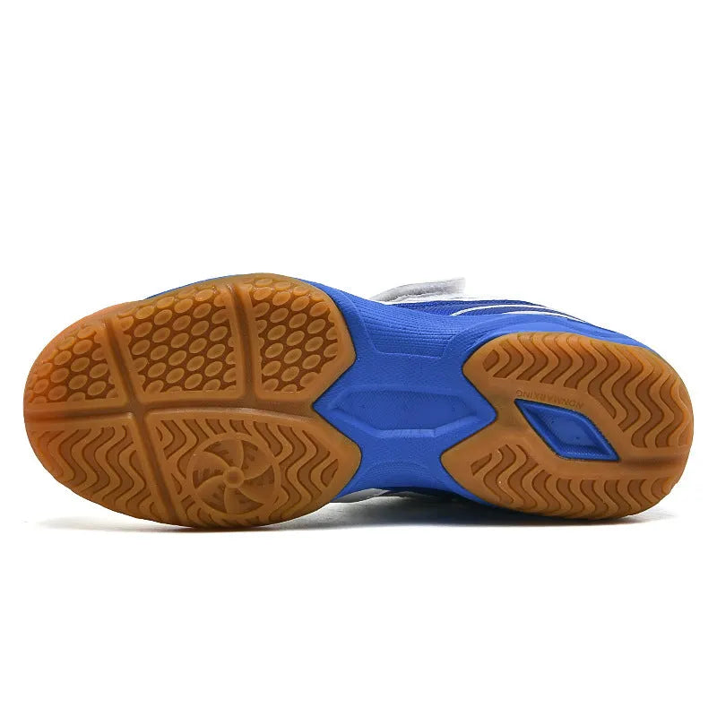 White and blue lightweight badminton shoes with ribbed sole and low-top PVC upper.
