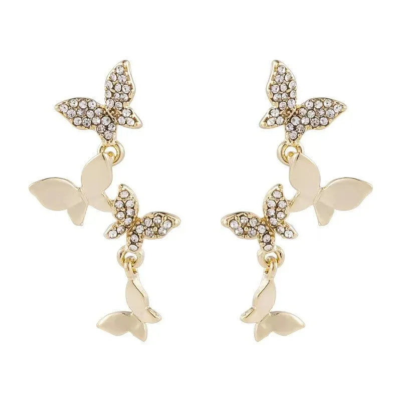 Women's gold colour copper butterfly drop earrings with four-butterfly design