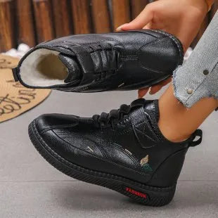 Women's black velvet cotton shoes with non-slip rubber soles showing low tube sock design