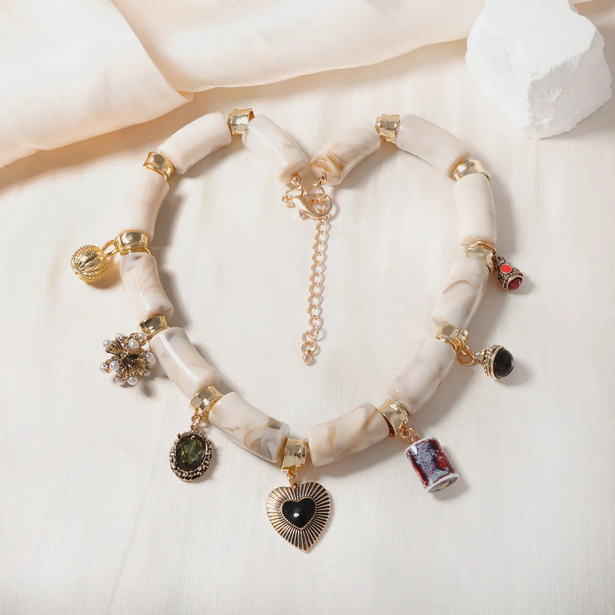 Bamboo resin heart pendant necklace with electroplated finish in pictured colour