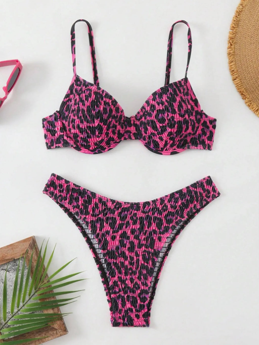 Women's leopard print backless bikini in brown mixed colour on a mannequin.