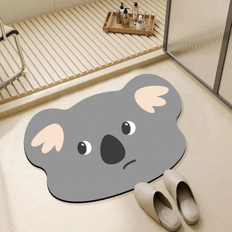 Colourful cartoon animal diatomaceous earth bathroom mat on tiles, showing non-slip base and absorbent texture.