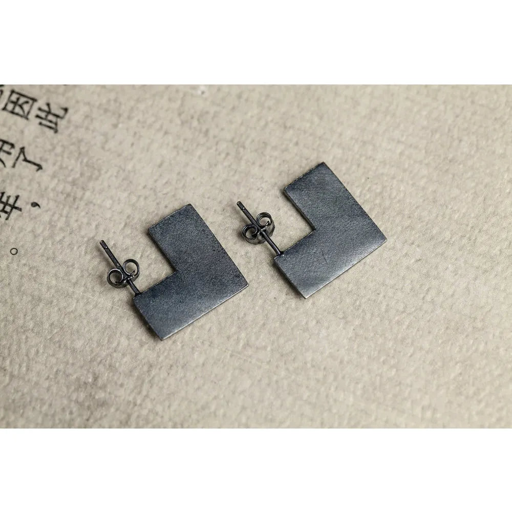 Oxidised black geometry square sterling silver earrings showing minimalist design and 16mm size