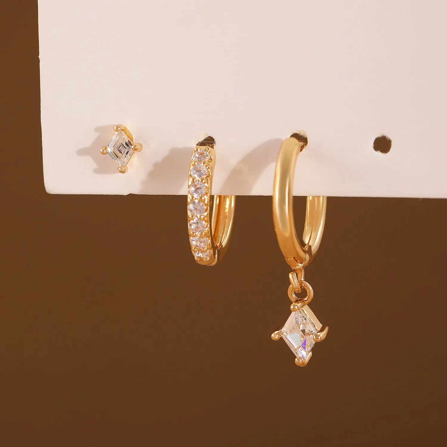 Ladies three-piece geometric earring set with zircon detailing in gold and white colours