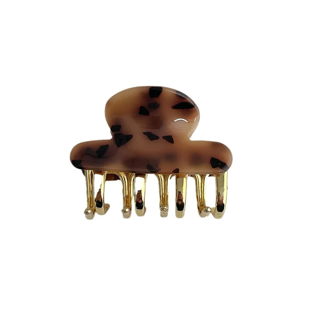 Dopamine retro acetate hair barrette with a metal grip in a medium size, shown in beige colour.