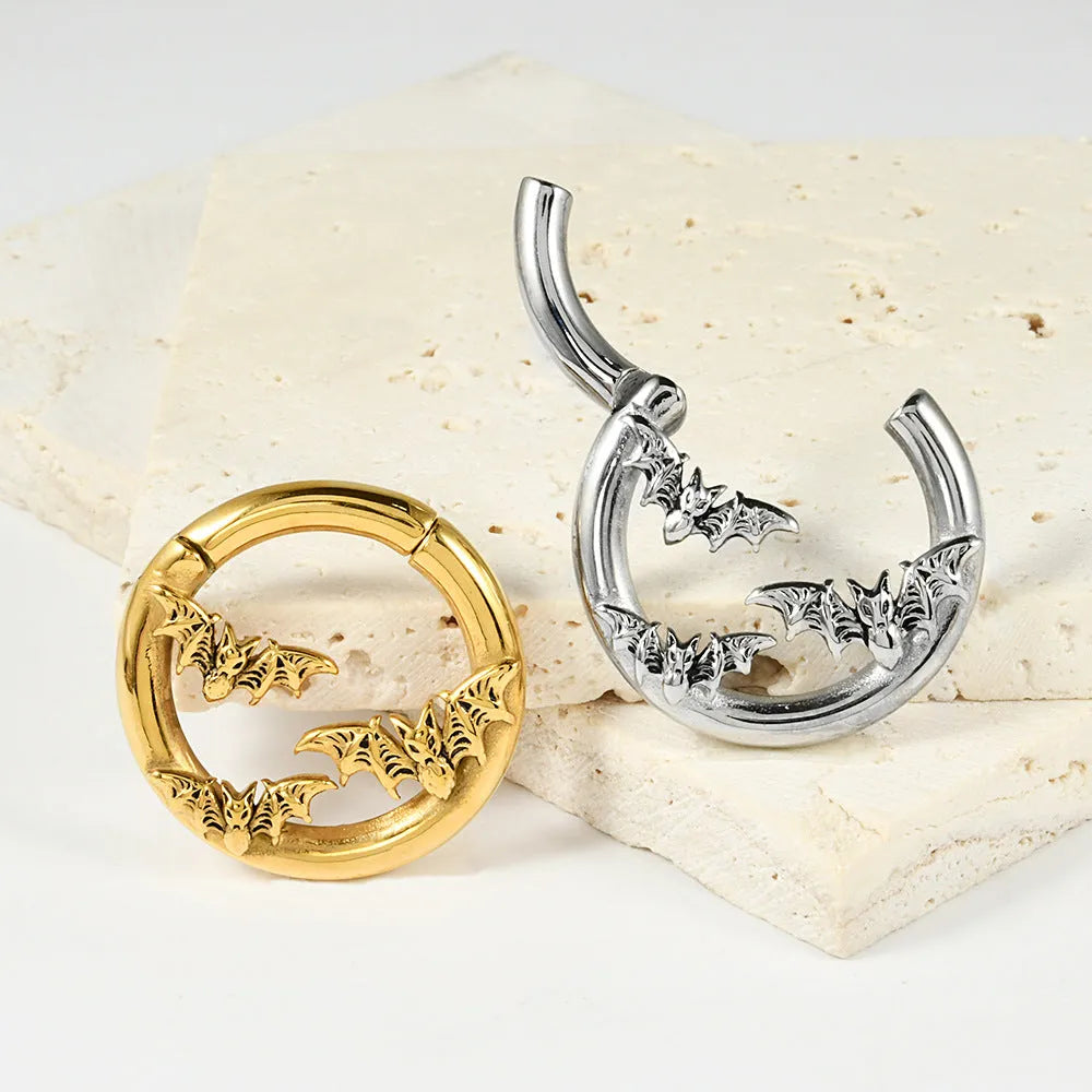 Fashion stainless steel earrings with a shaped totem pattern in an electroplated colour finish.