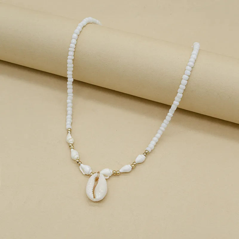 White conch shell bead necklace with mother of pearl pendant on regular chain