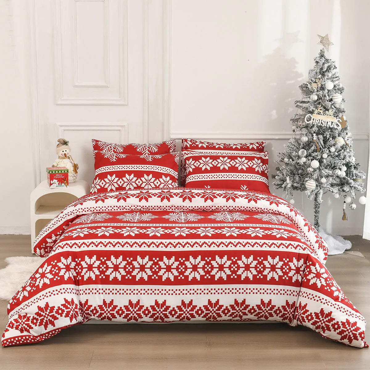 Red Christmas Love Song pattern bed cover-style quilt and pillowcases on a bed.