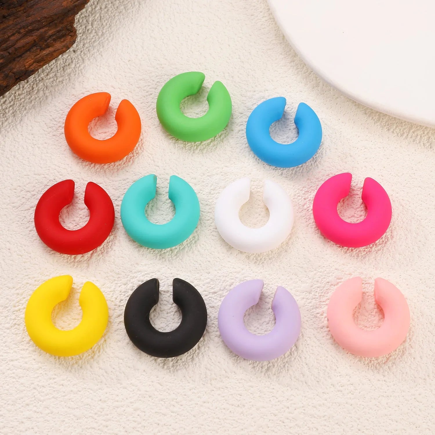 CCB material non-piercing ear clips in geometric C-shape with matte candy colours