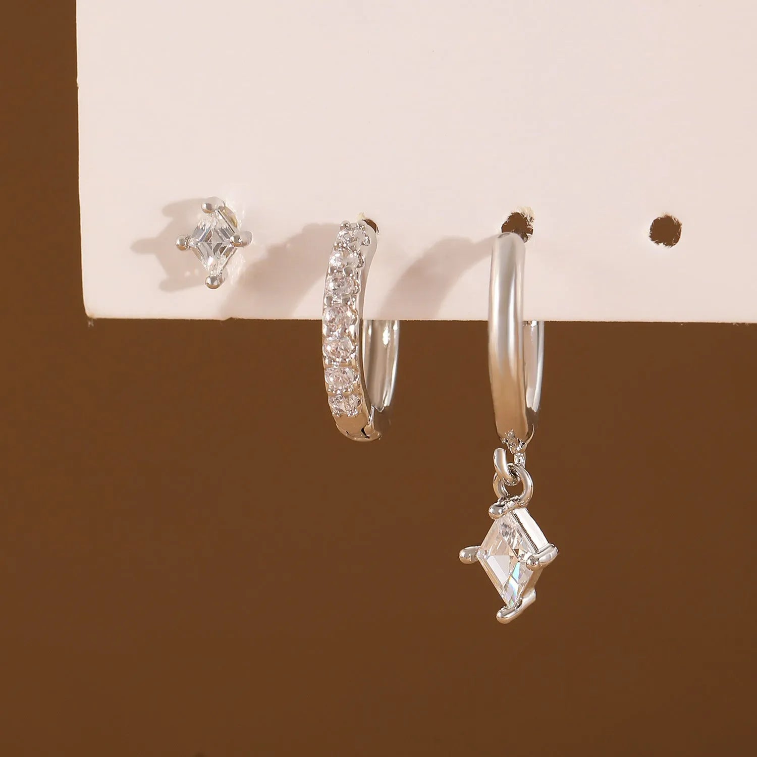 Ladies three-piece geometric earring set with zircon detailing in gold and white colours