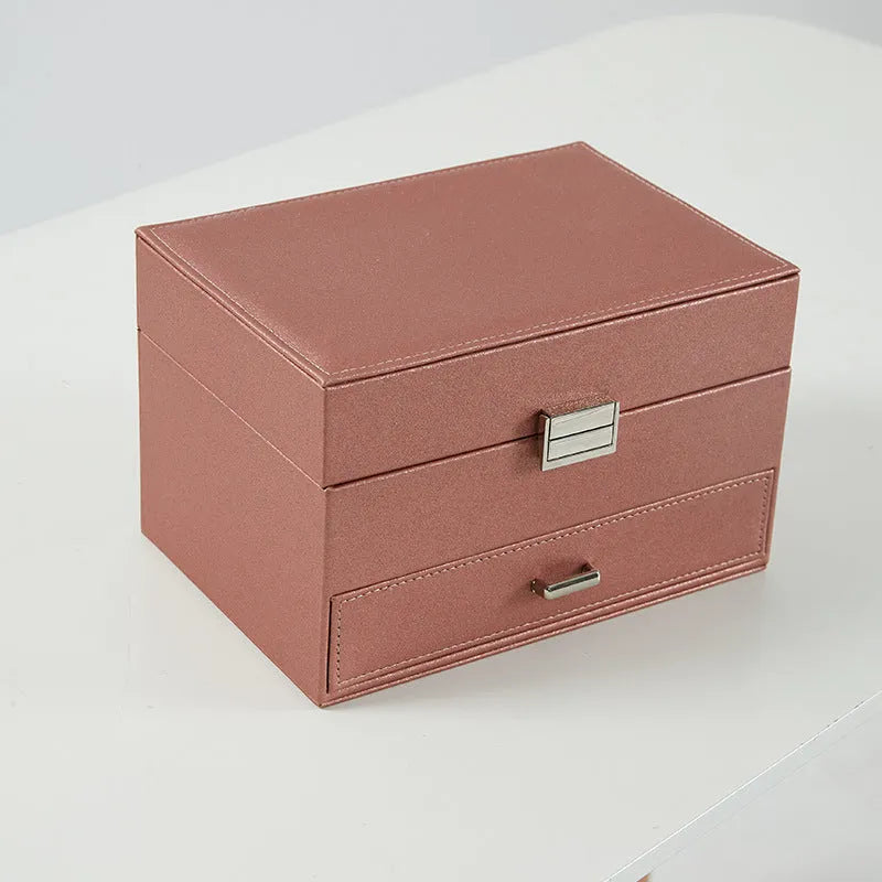 Hard leather jewellery storage box in beige, black, pink, or rose gold, showing its rectangular shape and compact size