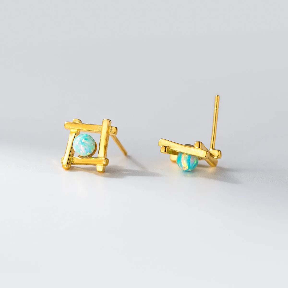 Women's geometric cross quadrangle stud earrings in 925 silver with silver or gold tone finishes