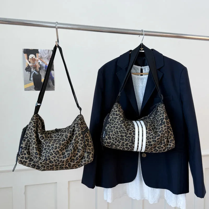Leopard print sports style messenger bag with cross-body strap and decorative stitching