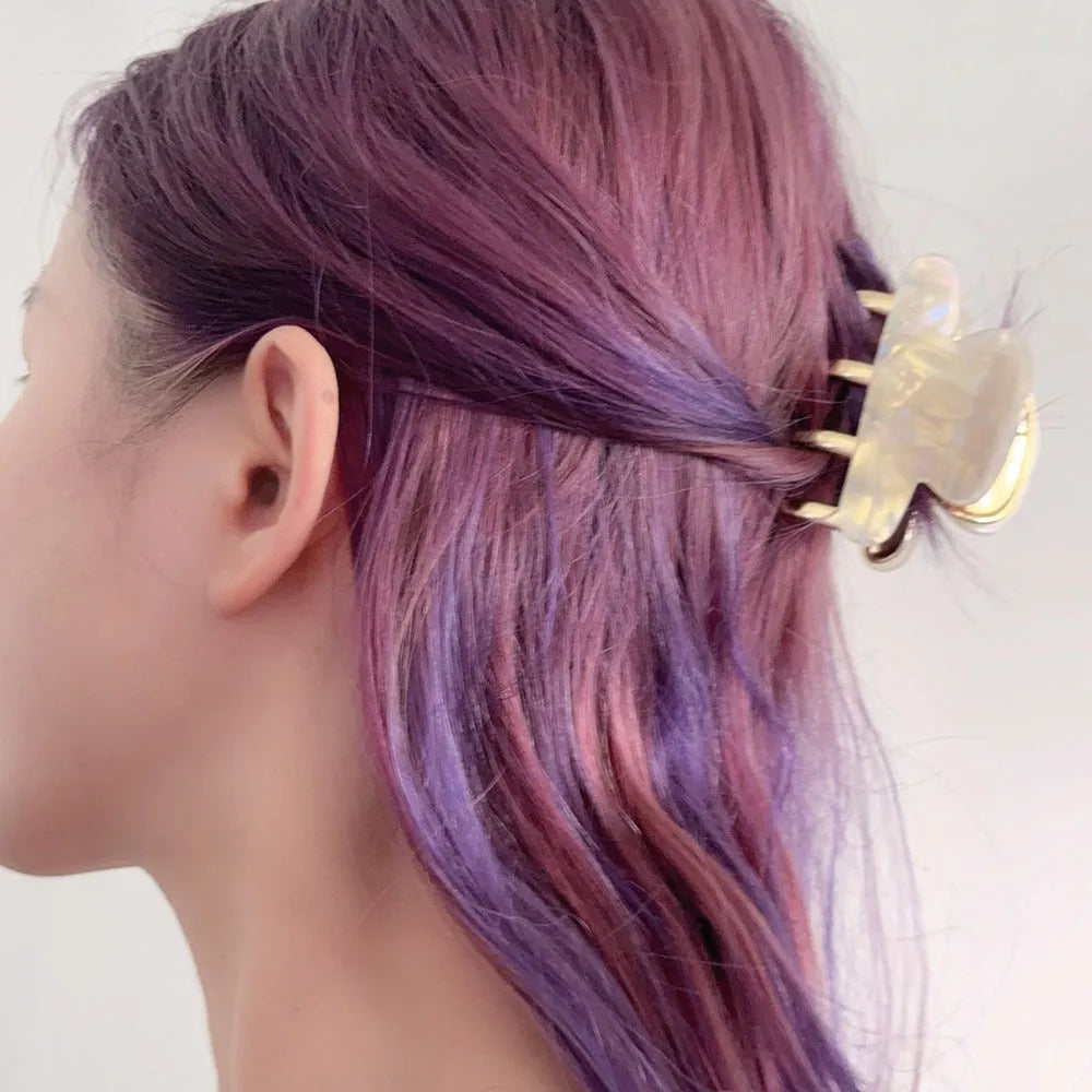 Dopamine retro acetate hair barrette with a metal grip in a medium size, shown in beige colour.