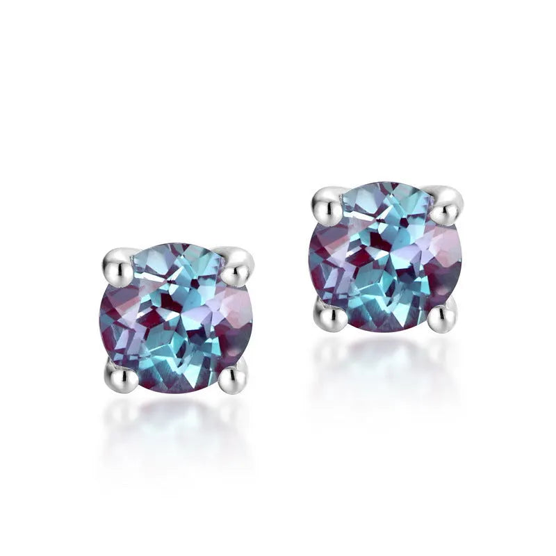 A pair of simple geometric ear studs for women in cultivated Alexandrite colour, made from 925 silver.