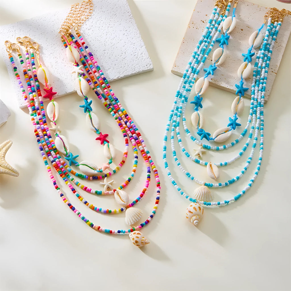Women's multi-layer necklace set with starfish, shell and conch bead pendants in blue