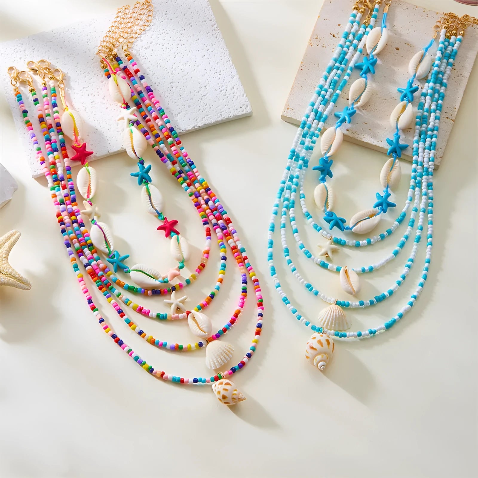 Women's multi-layer necklace set with starfish, shell and conch bead pendants in blue