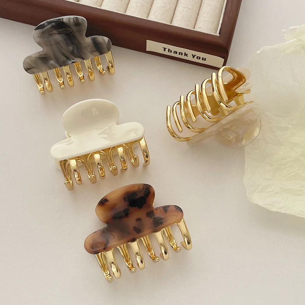Dopamine retro acetate hair barrette with a metal grip in a medium size, shown in beige colour.
