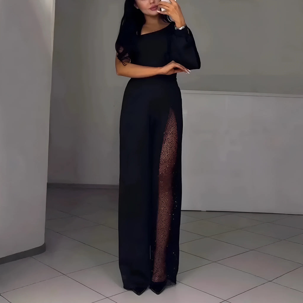 Women's long sleeve jumpsuit with oblique shoulder and high slit leg in polyester.