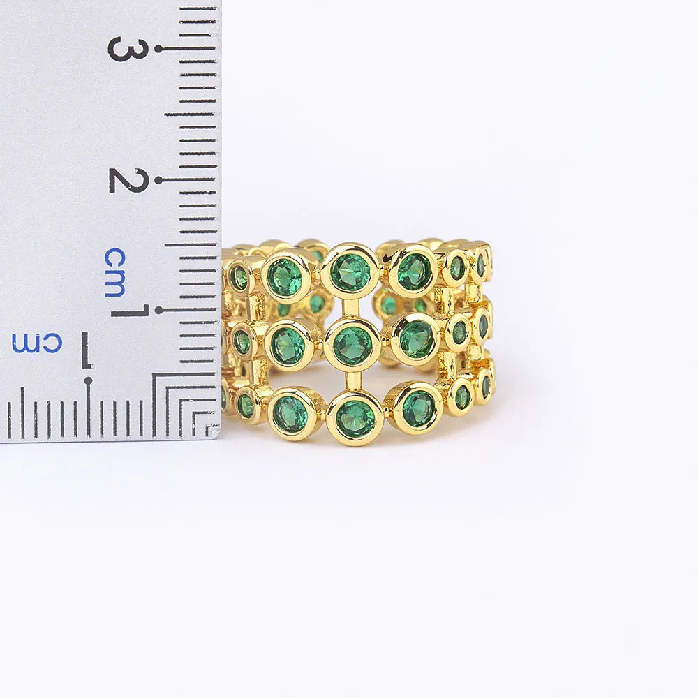 Copper ring with 18K gold plating and green zircon on exaggerated wide three-layer band