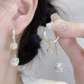 Silver-colour women's clip-on earrings with a confession balloon design, rhinestone ball, and double tassel pendant.