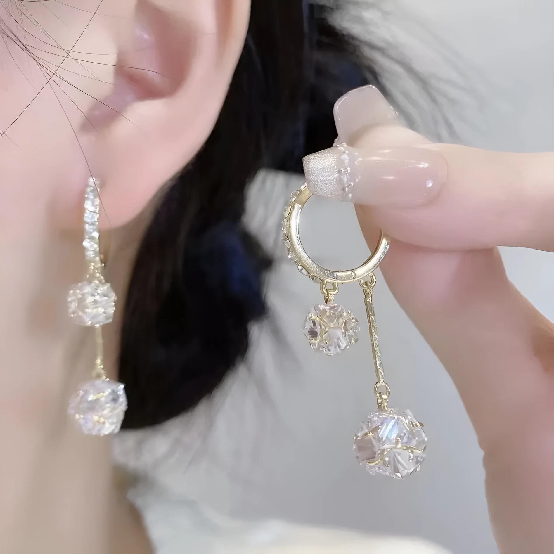 Silver-colour women's clip-on earrings with a confession balloon design, rhinestone ball, and double tassel pendant.