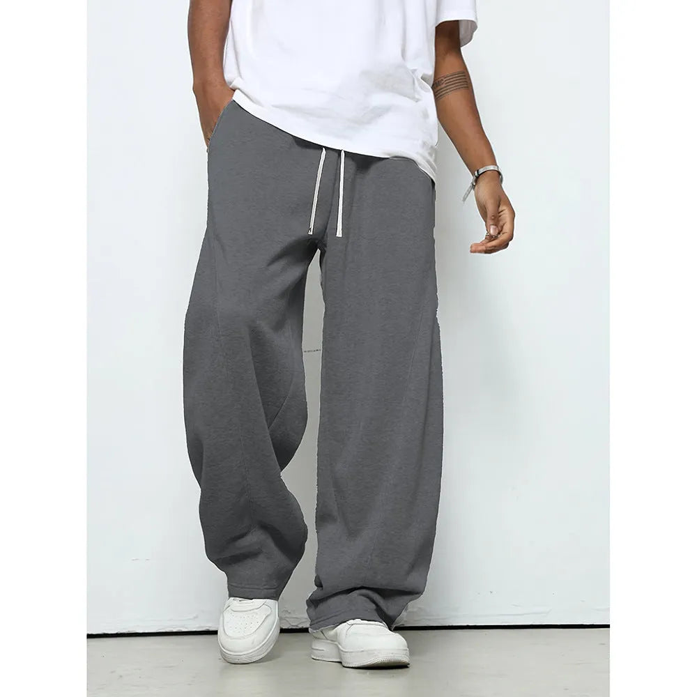 Men's straight-leg casual trousers in polyester fabric with drawstring waist in solid colour options